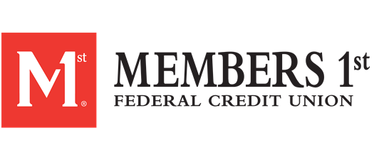 Portrait of a man with glasses wearing a gray shirt.